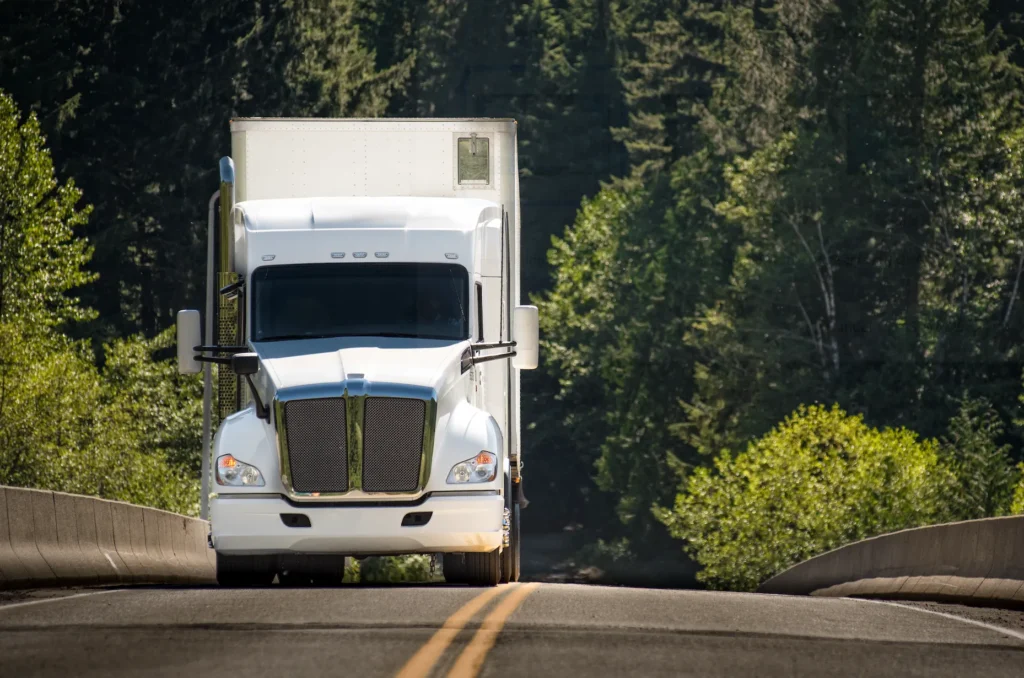 semi truck driving down the road