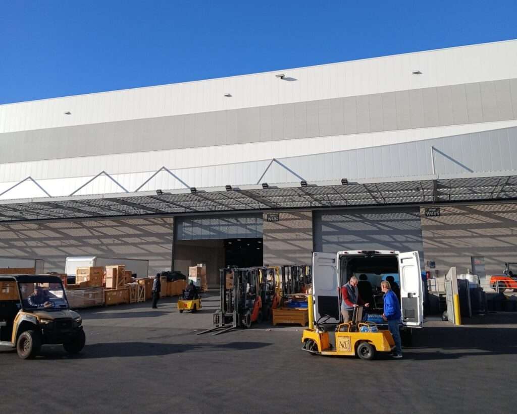 Shipping dock at a facility, showing loading and unloading operations.